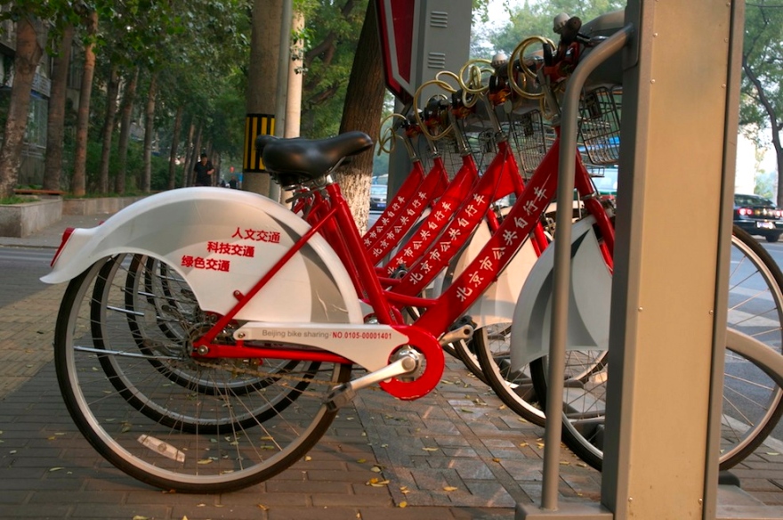 Beijing's new bike sharing system. Red rental bikes.